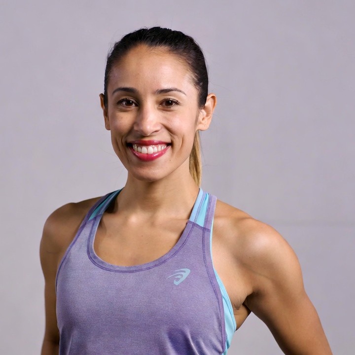Smiling athletic woman in tank top Smiling athletic woman in tank top