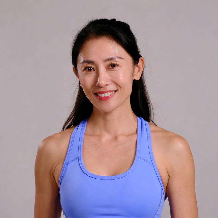 Asian woman in blue tank top Asian woman in blue tank top