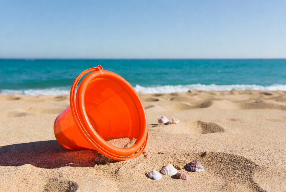 Orange beach pail with seashells Orange beach pail with seashells