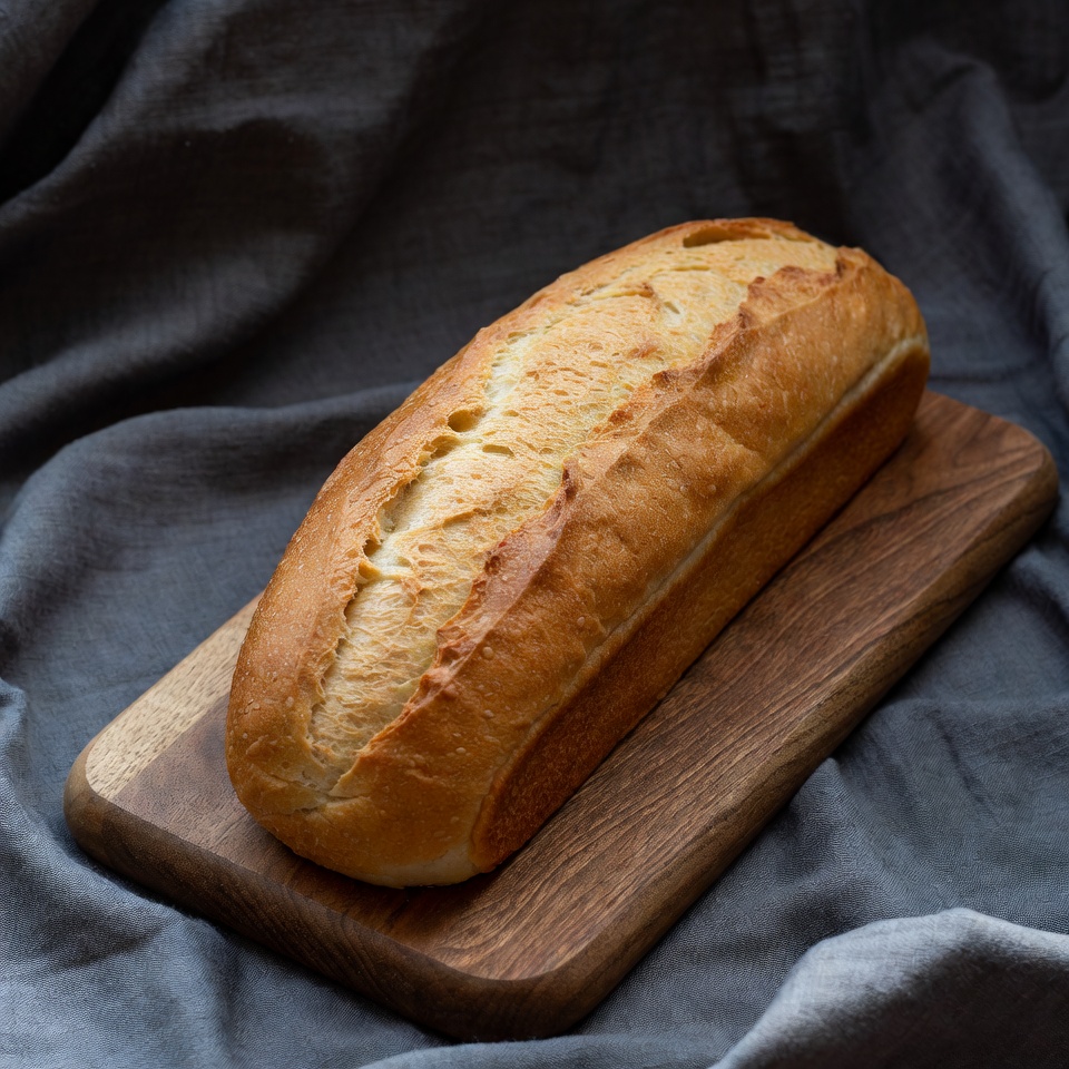 Fresh Baguette on Wooden Board Fresh Baguette on Wooden Board