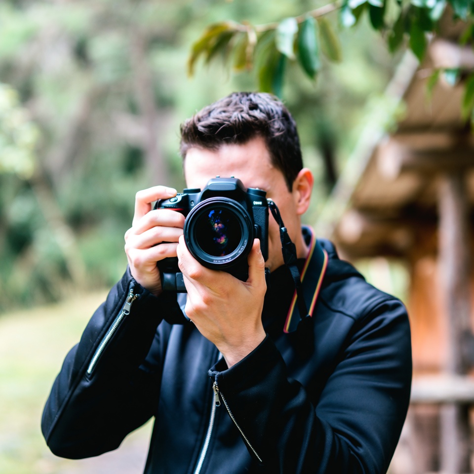 Man photographing in forest Man photographing in forest
