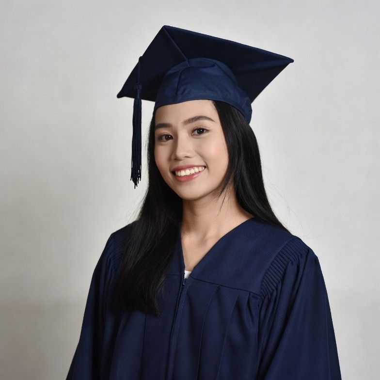 Asian girl in graduation gown and cap Asian girl in graduation gown and cap