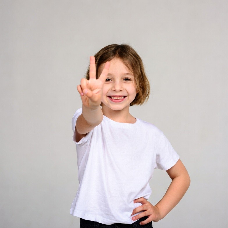 Girl making peace sign Girl making peace sign