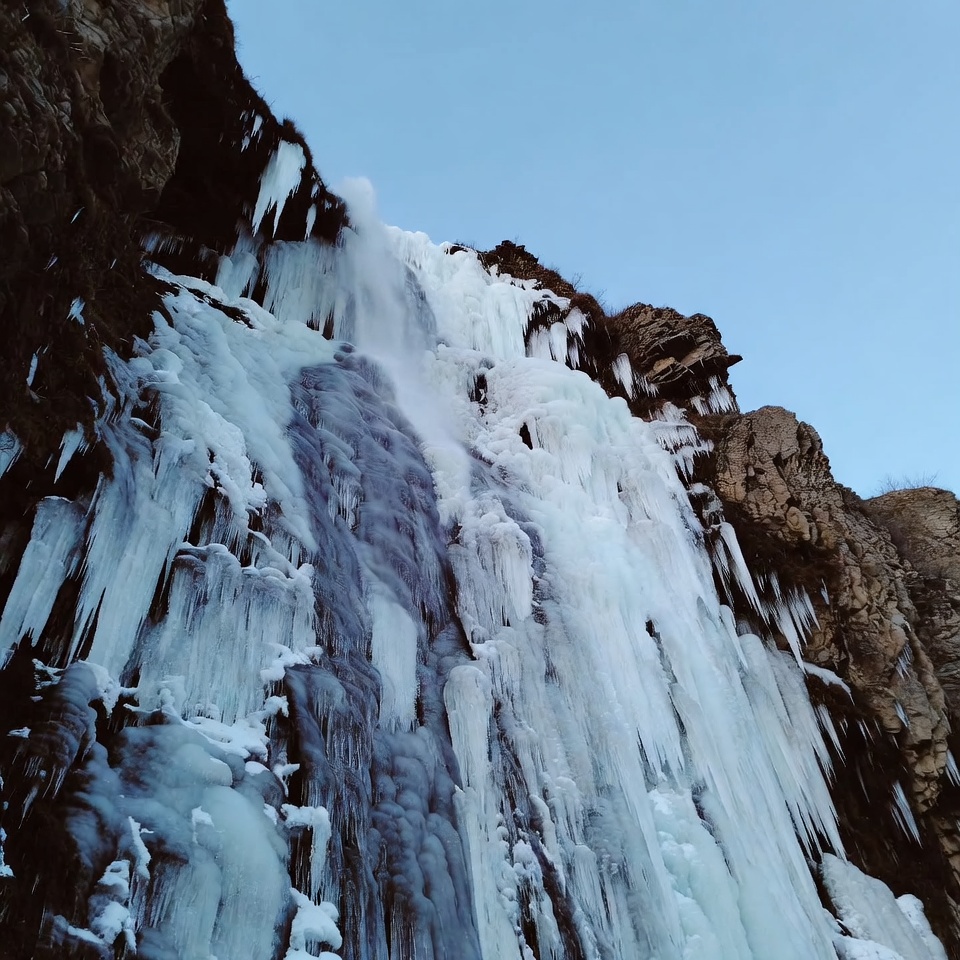 Frozen Waterfall on Rocky Cliff Frozen Waterfall on Rocky Cliff