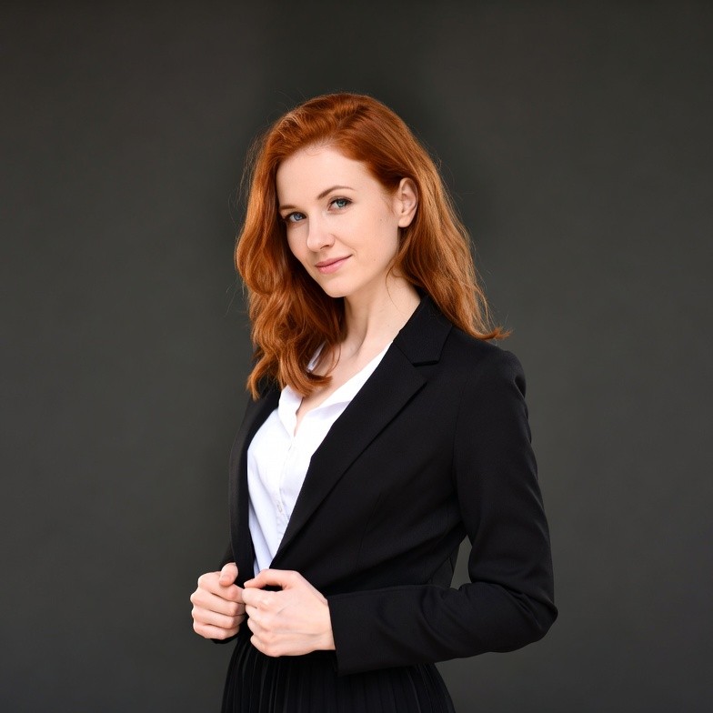Redhead woman in black blazer suit Redhead woman in black blazer suit