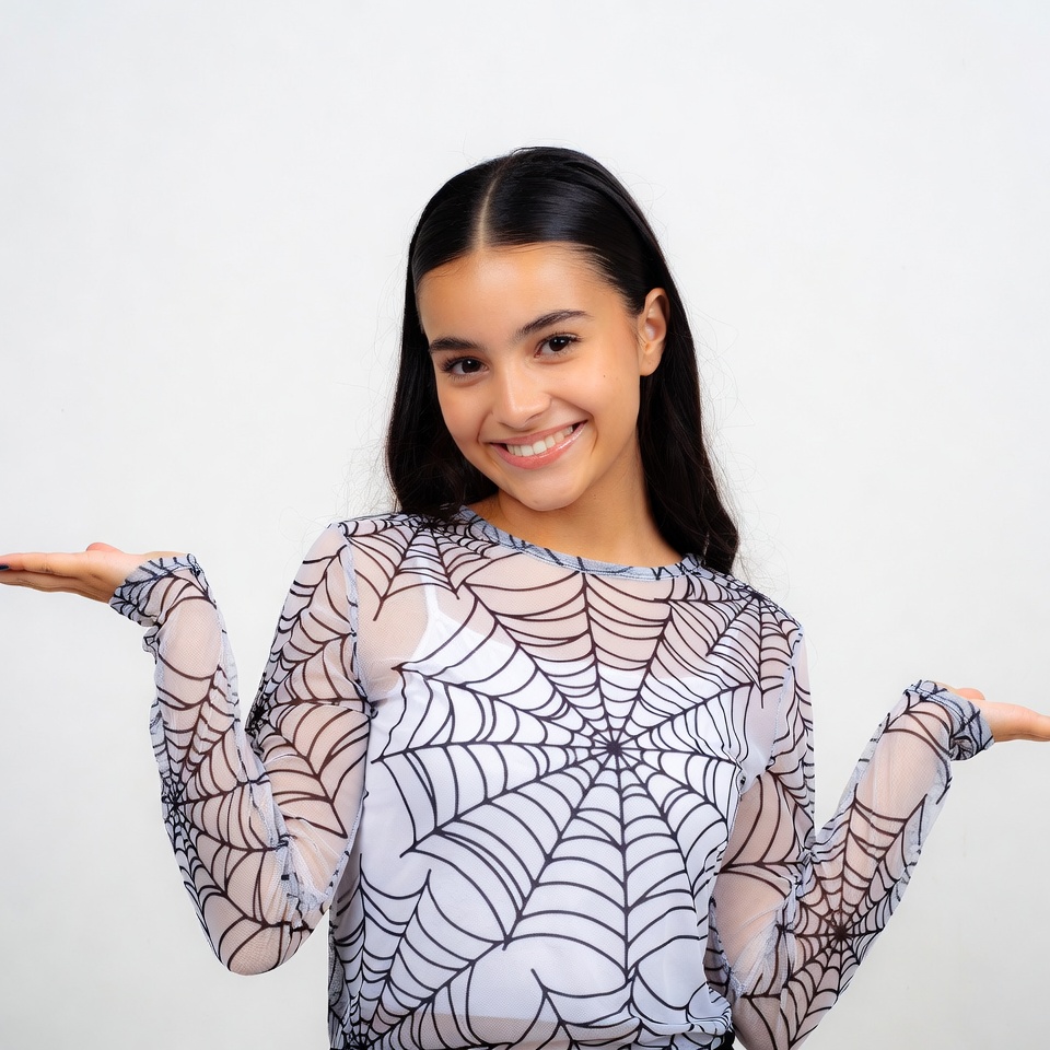 Girl in spiderweb shirt shrugging Girl in spiderweb shirt shrugging
