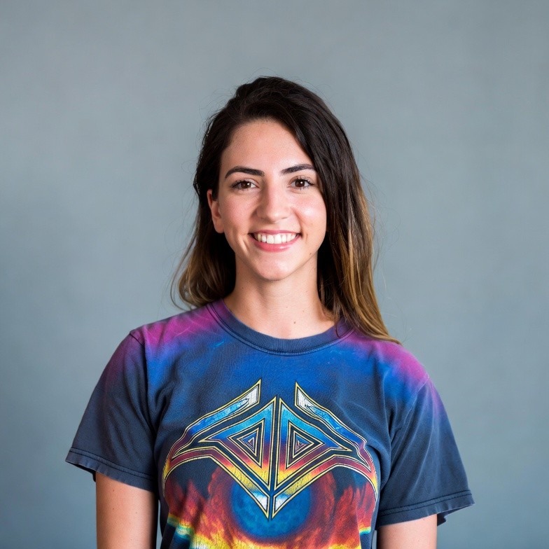 Smiling woman in colorful graphic t-shirt Smiling woman in colorful graphic t-shirt