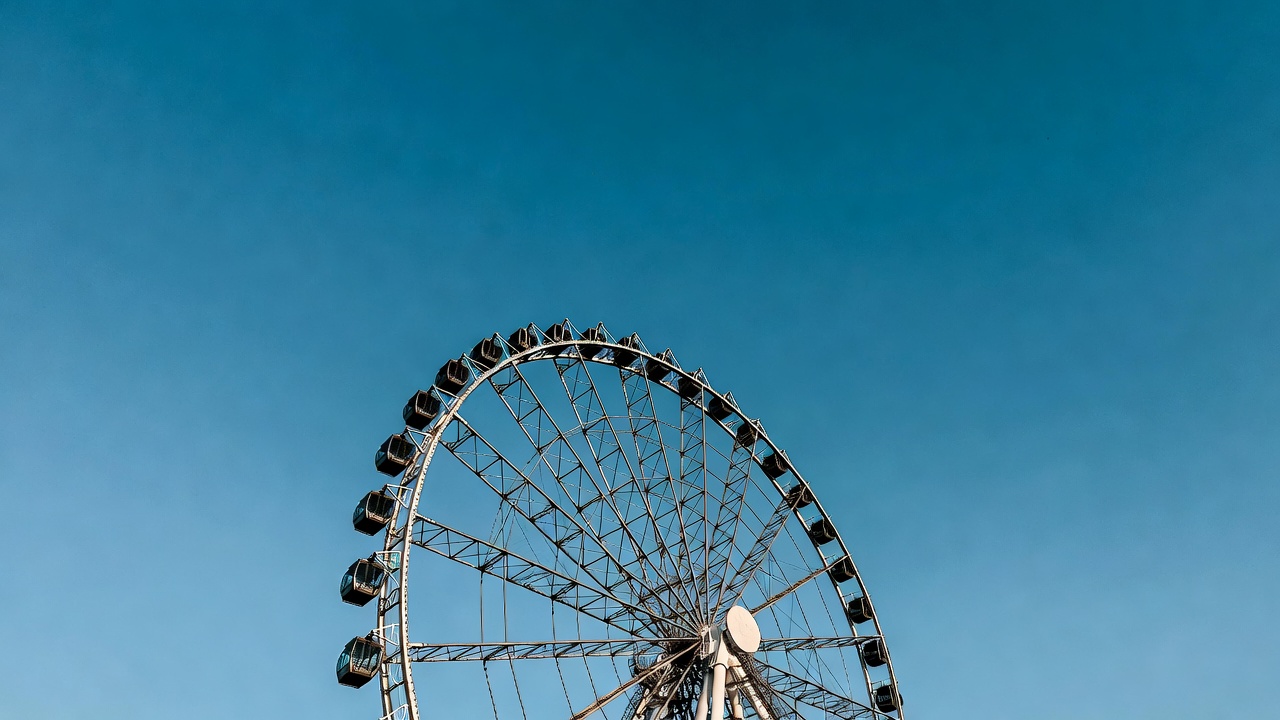 Ferris Wheel Against Blue Sky Ferris Wheel Against Blue Sky