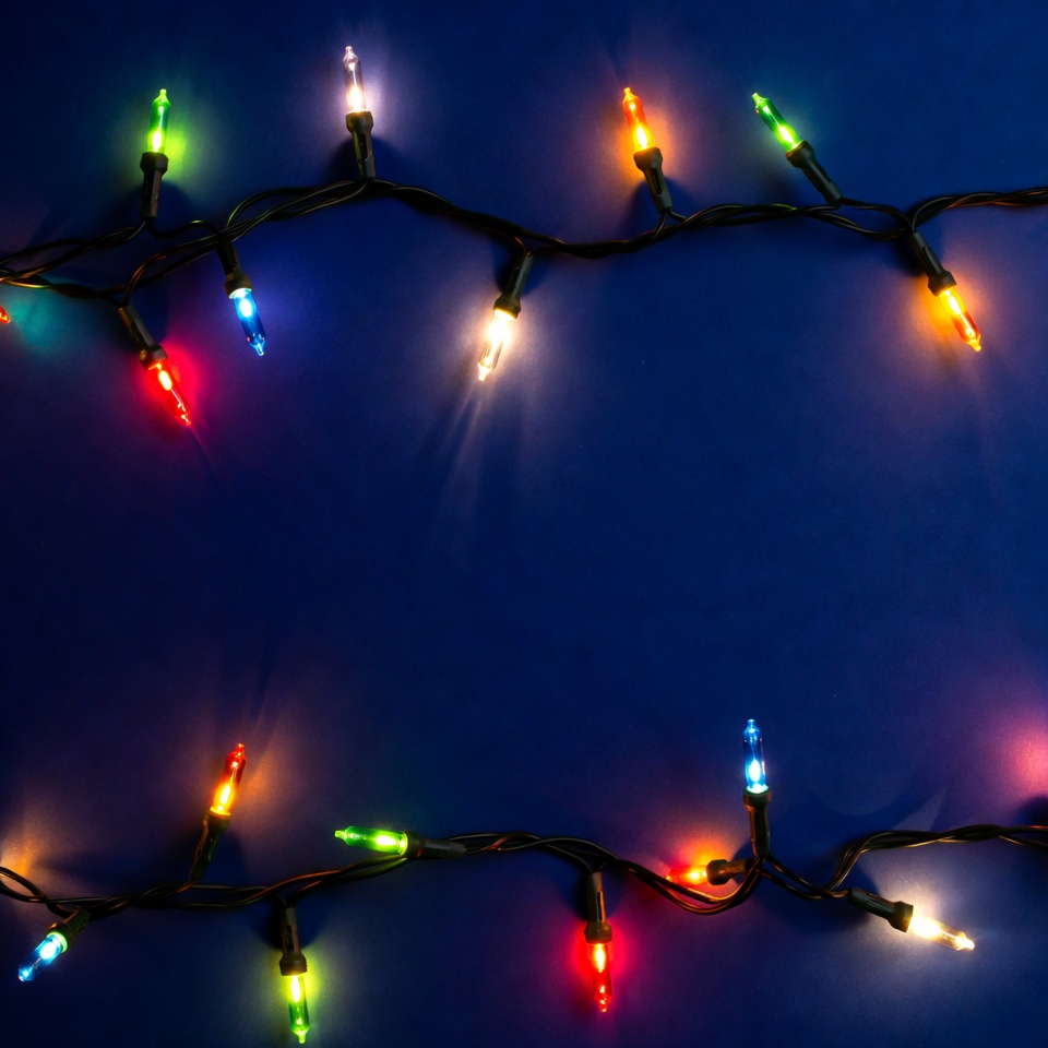 Colorful Christmas lights on blue background Colorful Christmas lights on blue background