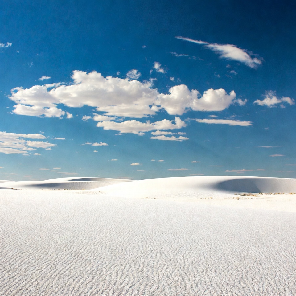 White sand dunes under blue sky White sand dunes under blue sky