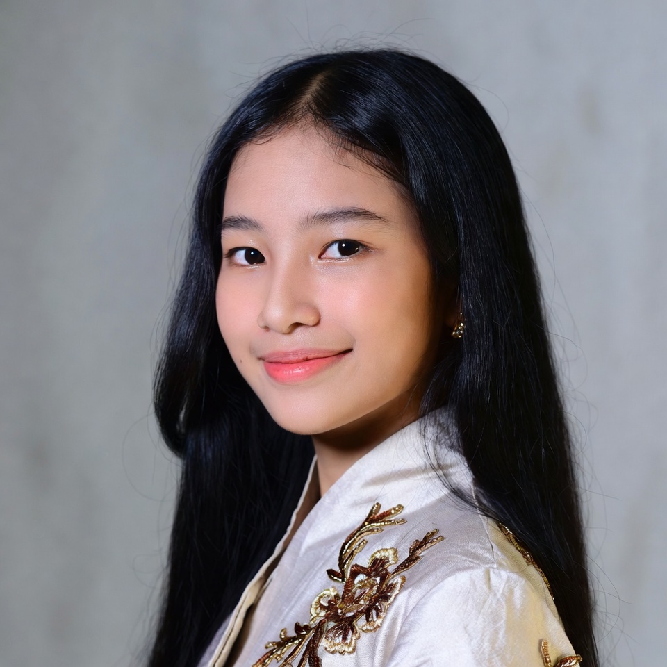 Asian girl in gold embroidered blouse Asian girl in gold embroidered blouse