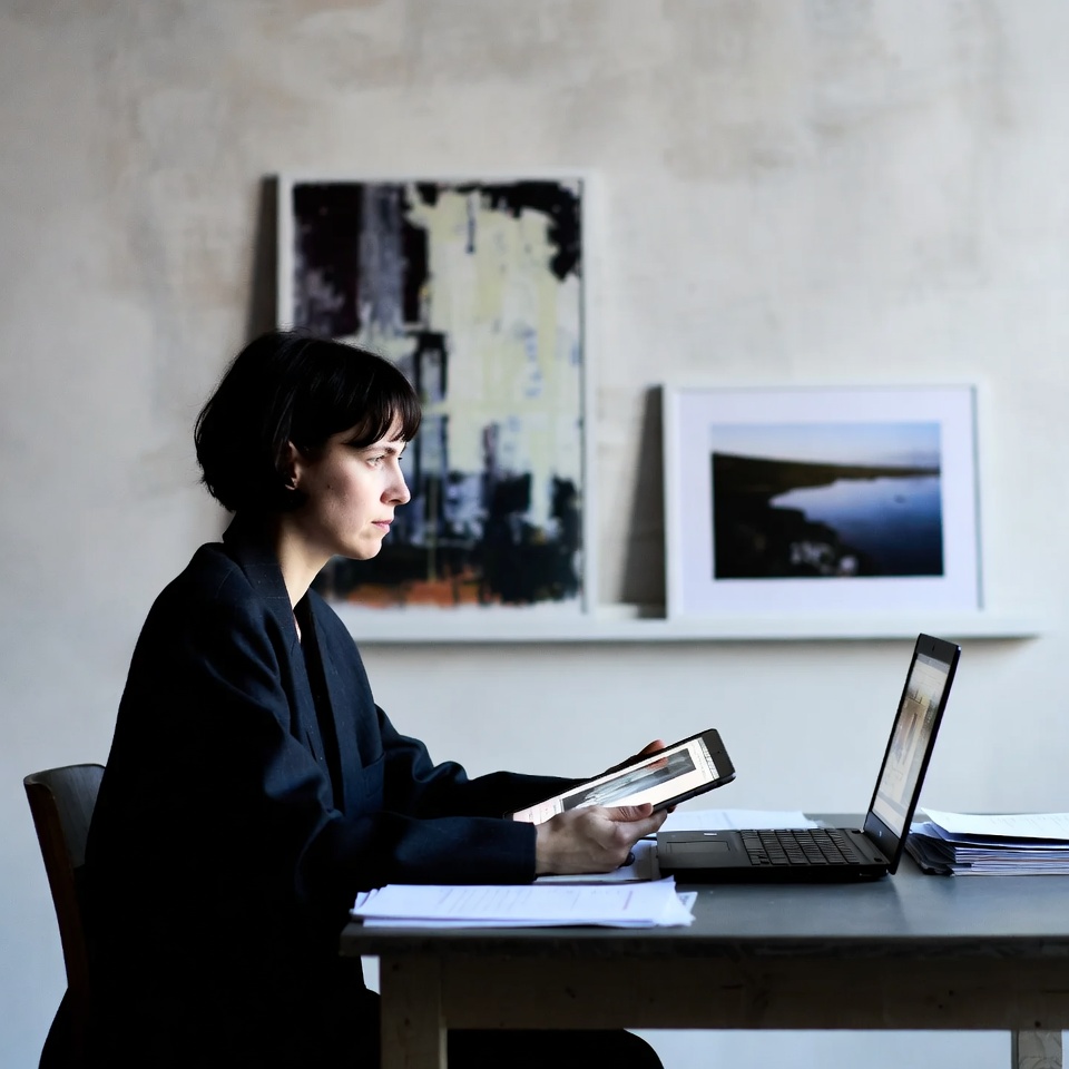 Woman working on laptop and tablet Woman working on laptop and tablet