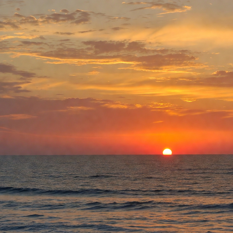 Sunset over ocean horizon Sunset over ocean horizon