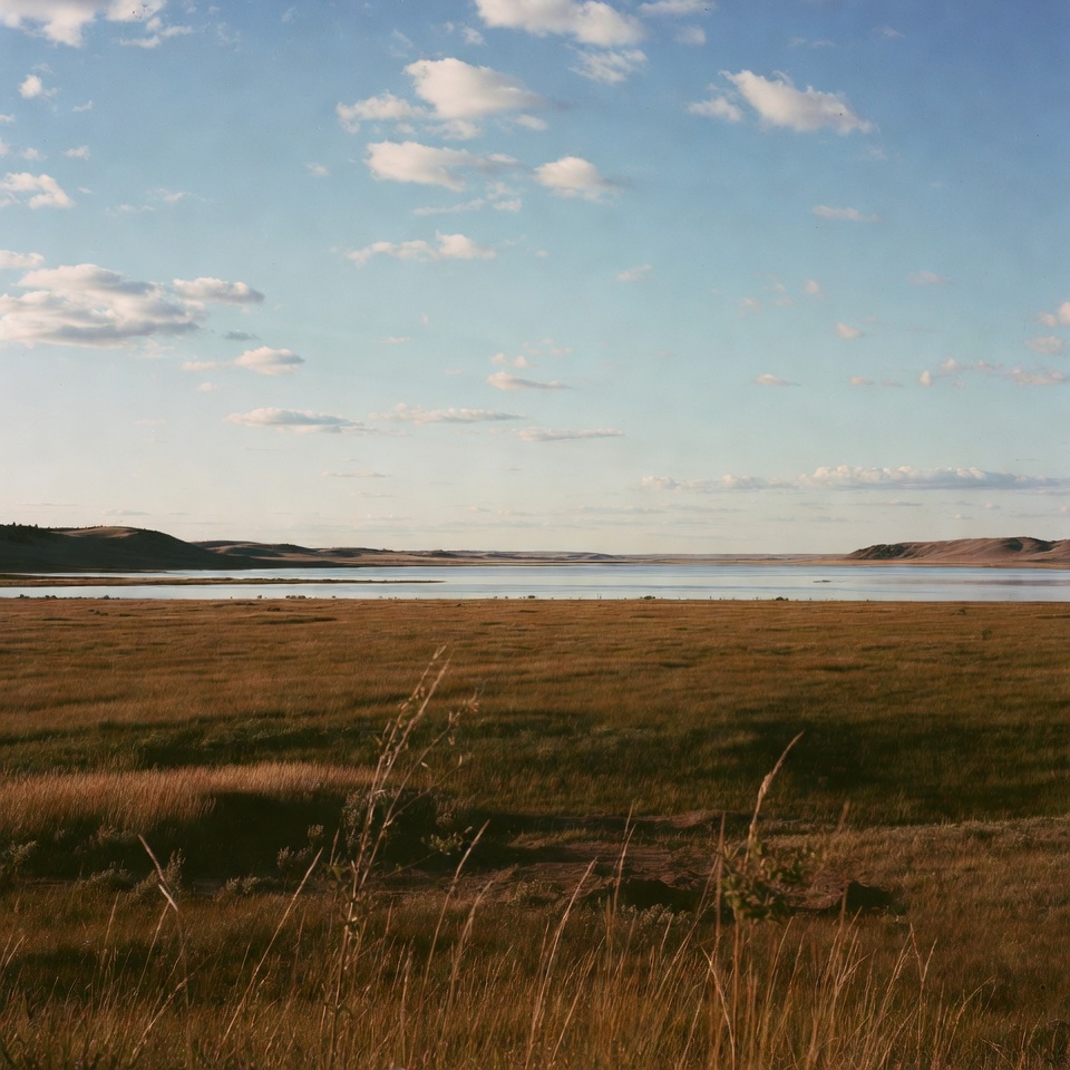 Vast Grassland Lake with Distant Hills Vast Grassland Lake with Distant Hills