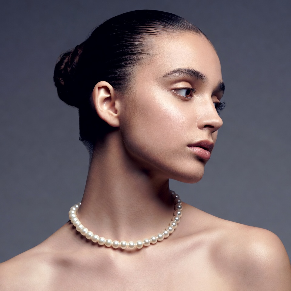 Woman with pearl necklace profile Woman with pearl necklace profile