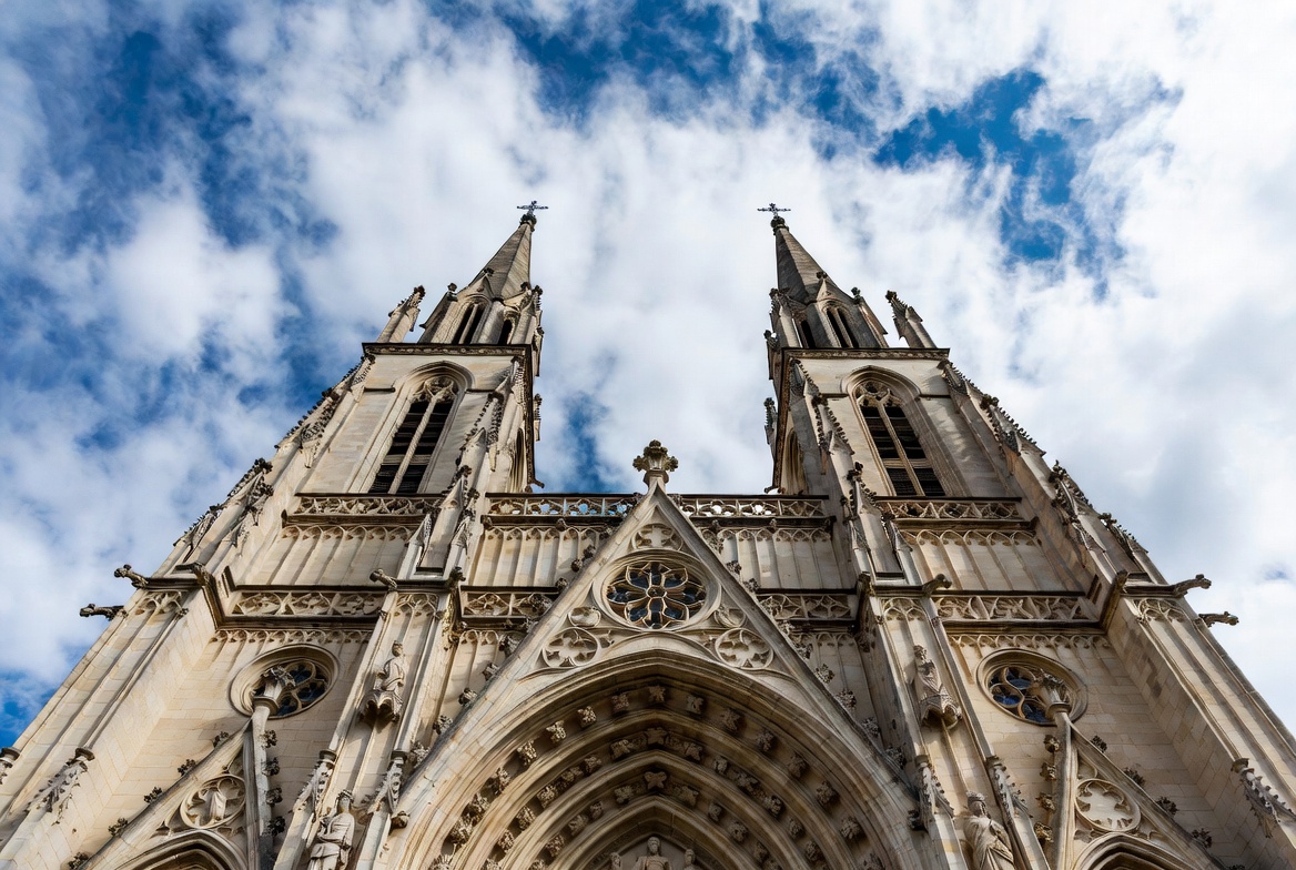 Gothic Cathedral Towers Against Blue Sky Gothic Cathedral Towers Against Blue Sky