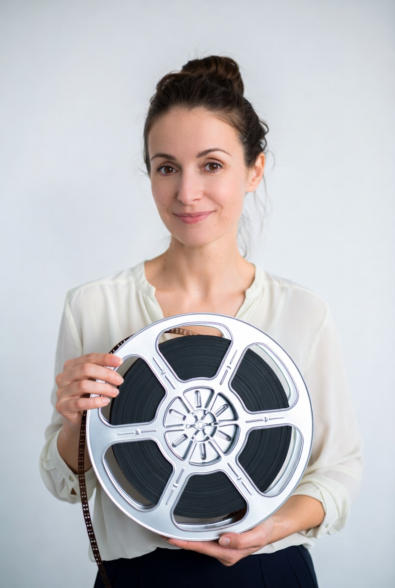 Woman holding film reel Woman holding film reel