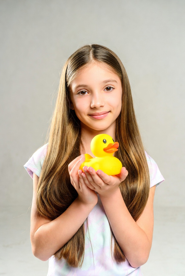 Girl holding yellow rubber duck Girl holding yellow rubber duck
