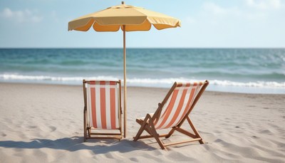 Two beach chairs under umbrella
