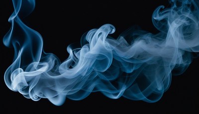 Blue smoke swirling against black background