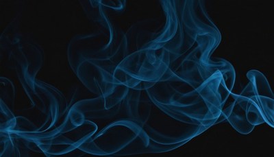 Blue smoke swirls on black background