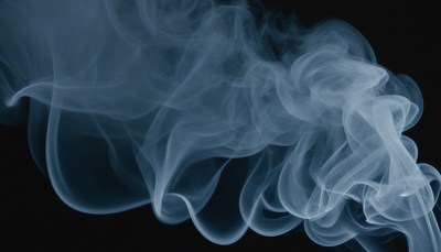 Blue smoke swirling against black background