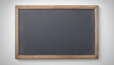Empty chalkboard on white wall