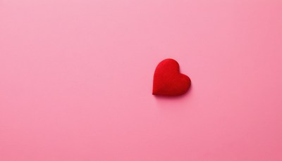 Red heart on pink background