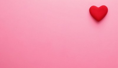 Red heart on pink background