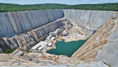 Stone quarry with teal lake