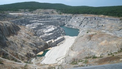 Quarry with lake and hills