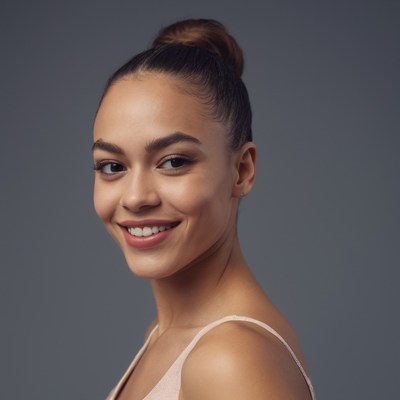 Woman smiling with hair in bun