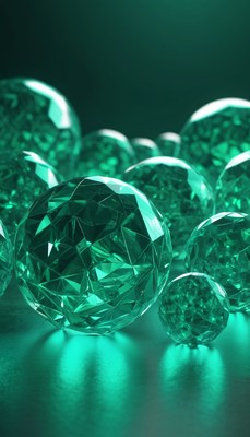 Emerald gemstones on green surface