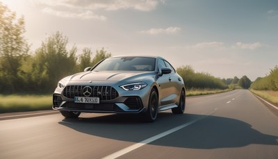 Grey sedan driving on country road