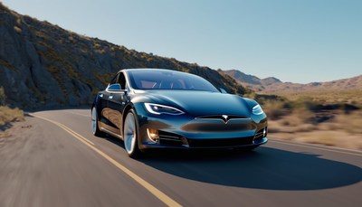 Tesla model s driving on desert road
