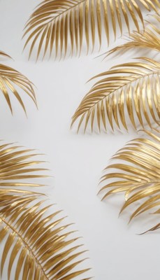 Golden palm leaves on white background