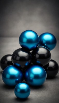 Blue and black spheres on grey background