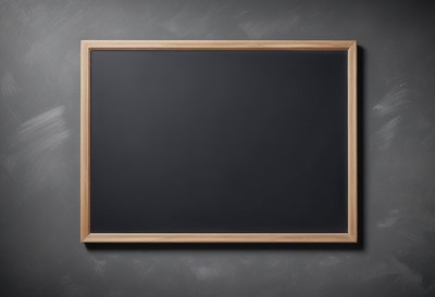 Empty chalkboard on gray wall