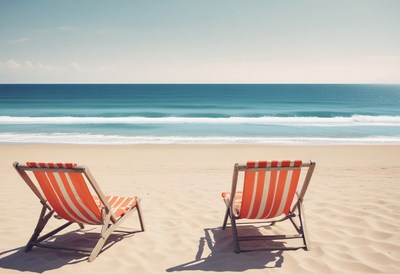Two beach chairs facing the ocean