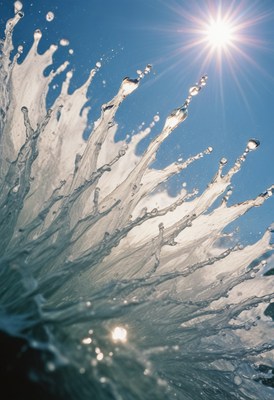 Water splashing under blue sky