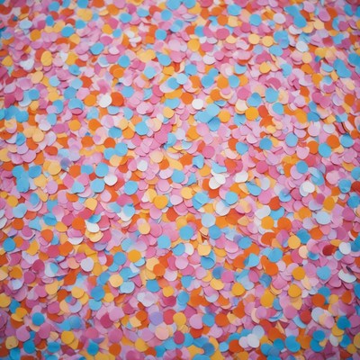 Colorful confetti scattered on ground