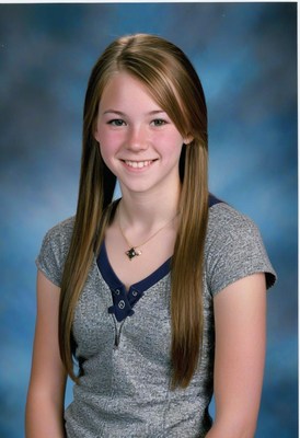 Girl smiling in grey shirt