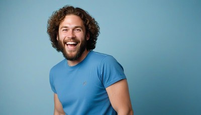Man laughing in blue t-shirt