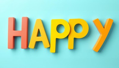 Colorful letters spell happy against blue background