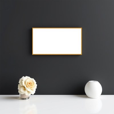 A white frame on a black wall