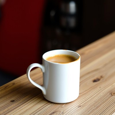 A cup of coffee on a wooden table