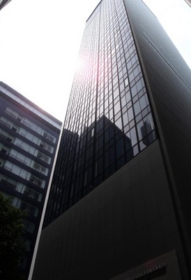 A tall glass building in the city