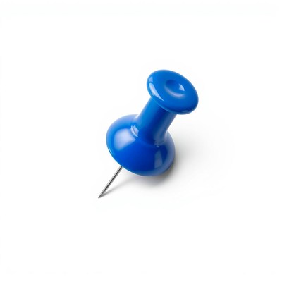 A blue pushpin sits on a white surface