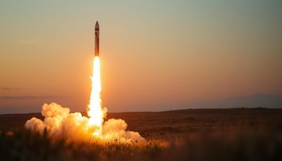 A rocket launches at sunset