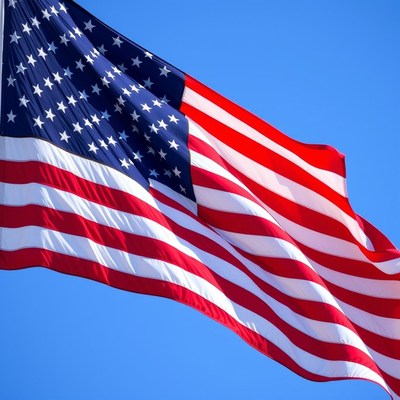 The american flag waves in the wind